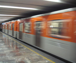 A train roars off in the underground. This is the Mexico City metro. © Anthony Wright, 2011