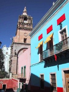 Bright-colored, modern buildings exist alongside older stone structures in Guanajuato © Geri Anderson, 2001
