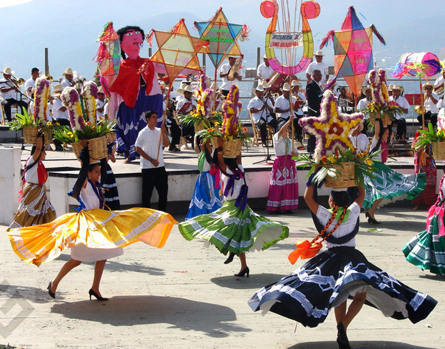 Chinas or "Chinese Girls" from Oaxaca's central valleys whirl to the music of a local folkloric orchestra.This is part of Oaxaca's annual Guelaguetza festivities held the last two Mondays of July.   © Oscar Encines, 2008