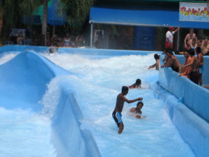 Rushing waters in El Revolcadero feel like river rafting. This is the author's favorite attraction in El Rollo Water Park under the warm Cuernavaca sun. © Julia Taylor, 2008