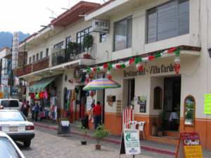 Shops and restaurants line the street, inviting visitors and residents alike inside to browse. © Julia Taylor 2007