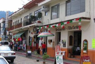 Shops and restaurants line the street, inviting visitors and residents alike inside to browse. © Julia Taylor 2007