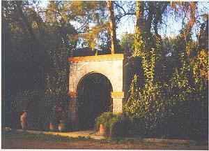 A colonial-styled archway leads to one of the on-campus homes opposite the school's Hotel San Andres.