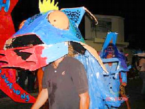 Carnival is a multi-cultural experience and everyone is encouraged to join. Many of the foreigners living on the island enter the parade in outlandish costumes like this one, depicting a blue dragon.