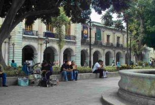 Oaxaca's zócalo, with facade of presidential palace in background, is a pleasant place to spend the afternoon. © Dan Ellsworth, 2009