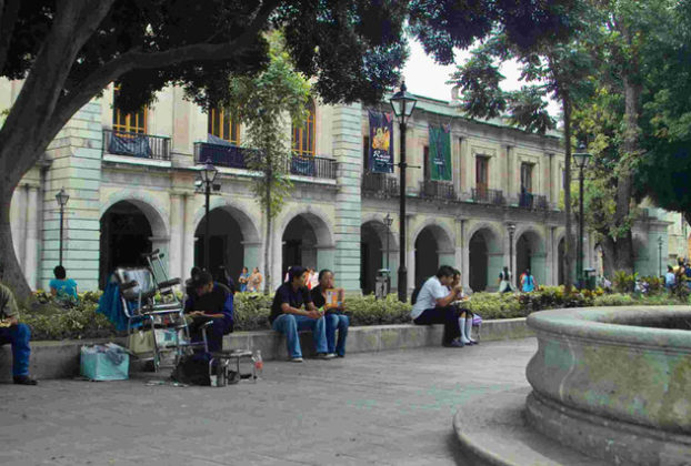 Oaxaca's zócalo, with facade of presidential palace in background, is a pleasant place to spend the afternoon. © Dan Ellsworth, 2009