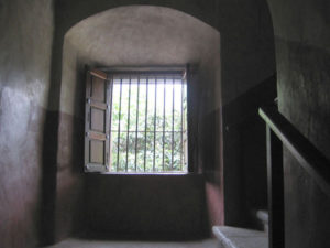 A window in the ancient adobe wall beside a stone staircase in the Tepoztlan monastery. © Julia Taylor 2007