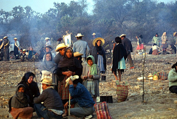 The following morning after a campfire breakfast, the group breaks camp and prepares for another long hike.