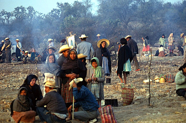 The following morning after a campfire breakfast, the group breaks camp and prepares for another long hike.