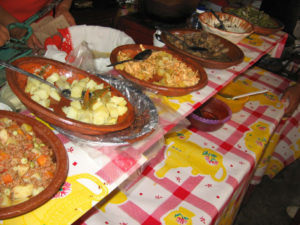 Fillings for quesadillas are laid out where diners can see them. From left to right, picadillo, potatoes, tinga and mushrooms offer a variety of flavors. Bowls of red and green salsa sit on the shelf below them. © Julia Taylor 2007