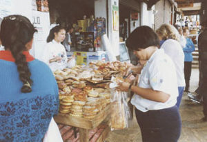 Fresh baked goods for sale in the arcades surrounding the plaza. Mazamitla, a mountain town in Jalisco, is famous for its cream, milk candy and dairy products as well as fruit jams and conserves. © Tony Burton, 2000