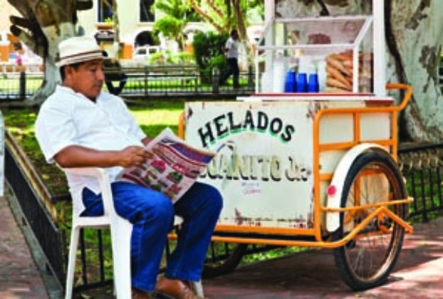 Ice cream carts have been a feature of Yucatecan life for at least a century. Photo by Eduardo Cervantes. An ice cream vendor in a Merida park