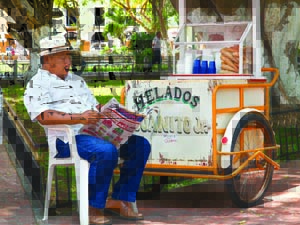 Ice cream carts have been a feature of Yucatecan life for at least a century. Photo by Eduardo Cervantes. An ice cream vendor in a Merida park