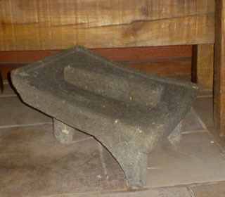 Metate and mano for grinding corn © Daniel Wheeler, 2009