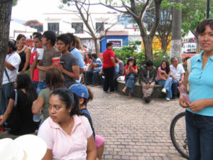 Spectators in the plaza are captivated by the impromptu drumming. © Julia Taylor 2007