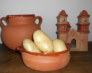 Potatoes in a terracotta cazuela © Daniel Wheeler, 2010