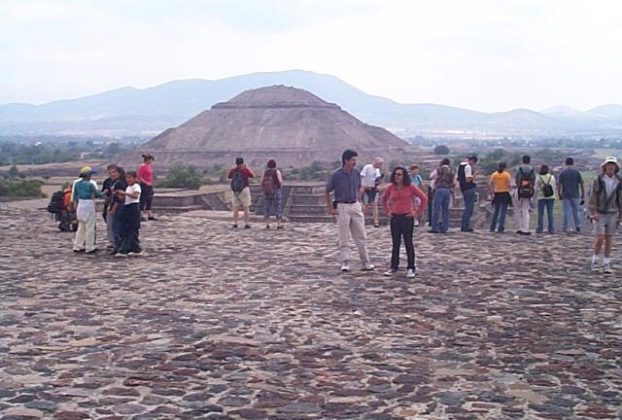 From the plaza part way up the pyramid of the moon, the pyramid of the sun appears to take on the shape of the distant hill.