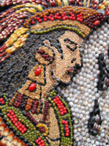 The images in the archway are intricate mosaics of colorful seeds. © Julia Taylor, 2007