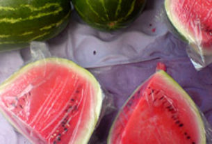 Succulent watermelon tempts shoppers in a Mexican tianguis, or traveling street market. © Daniel Wheeler, 2009