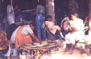 Local ladies make tortillas at the Day of the Kings feast that Professor Garcia throws for the choir in his garden. Families, friends and townspeople are all invited.