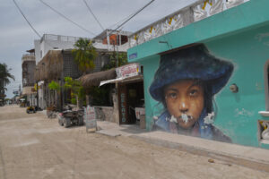Fishing boats sit Mural on the streets of Isla Holbox, Mexico © Ryan Biller, 2021