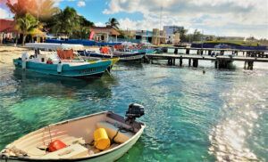 The boats from the mainland cross the Bahia de Mujeres to the downtown area where there are restaurants, shops, galleries, and golf cart rentals to navigate the island. © 2021 Jane Simon Ammeson