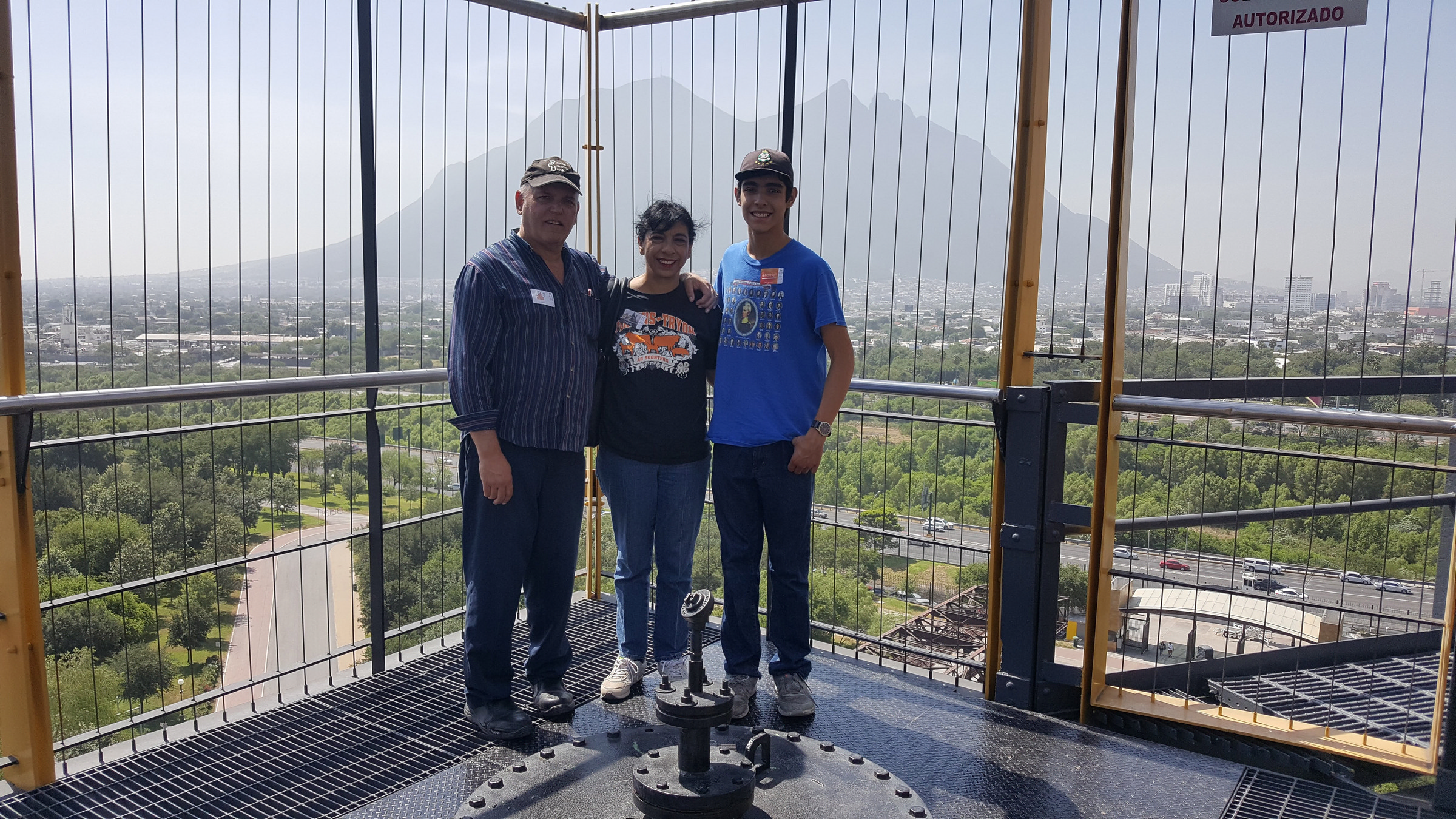 Allan, Lilia and Raphael atop the Blast Furnace, with Monterrey's Cerro de la Silla mountain in background. 