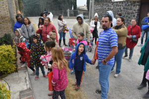 Families singing for treats during Cappo d’Anno. © Joseph Sorrentino, 2023