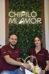 Aldo Zeron Solair and his mother Irene Solari Fierro with a basket of their cheeses and other products. © Joseph Sorrentino, 2023