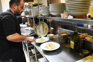 Chef Jonathan Dossetti Mazzocco of Restaurante Veneto preparing Fusilli Paris © Joseph Sorrentino, 2023