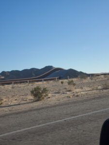 Border Wall climbing hill © 2023 Allan Wall.