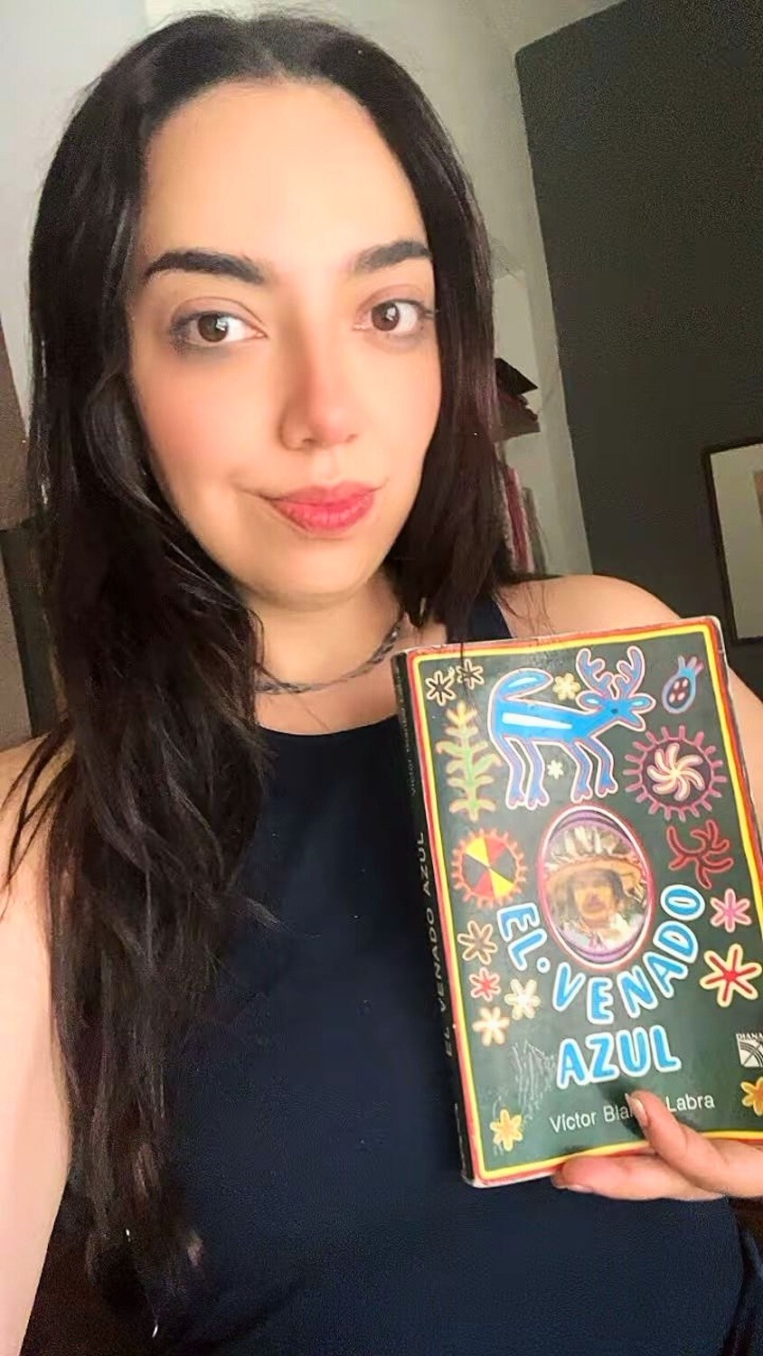 Author's friend with copy of El Venado Azul. © 2025 Carlene Fowlkes. 