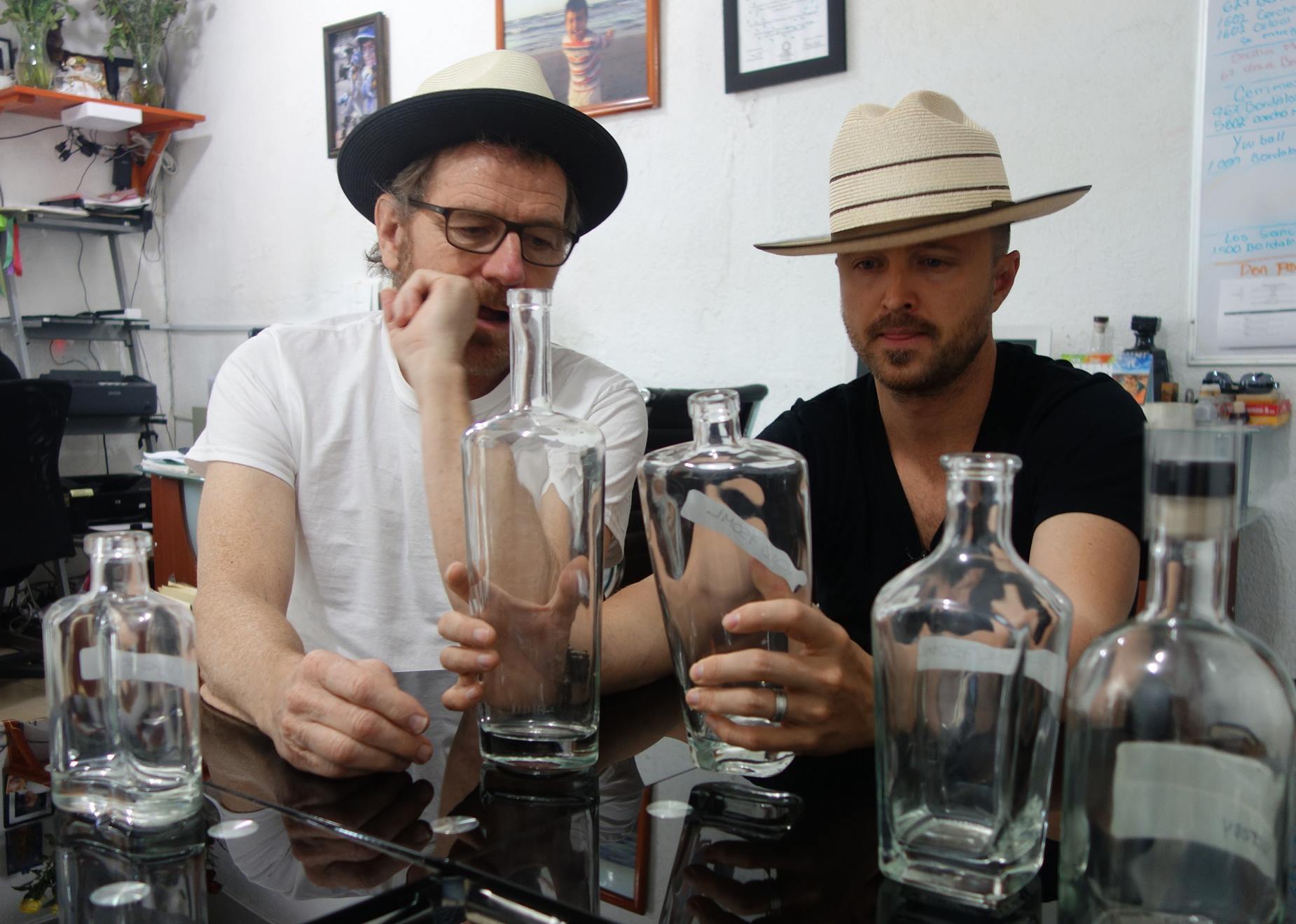 Breaking Bad stars examining bottles for Dos Hombres brand. © Alvin Starkman, 2025